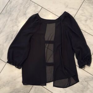 Black open back shirt; dress up or down; super cute